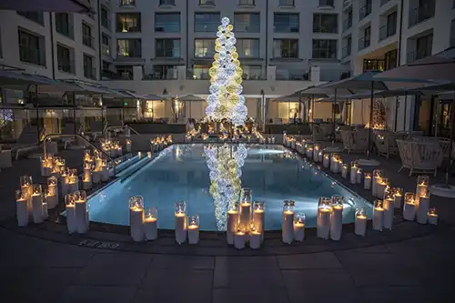 Holiday bash for Strategic Hotels & Resorts at The Regent Hotel in Santa Monica, CA with beautiful holiday tree reflecting in the pool